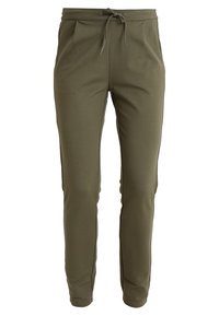 Olivgrüne Jogginghose aus weichem Material, mit Seitentaschen, elastischem Bund mit Kordelzug und tapered Bein Design.