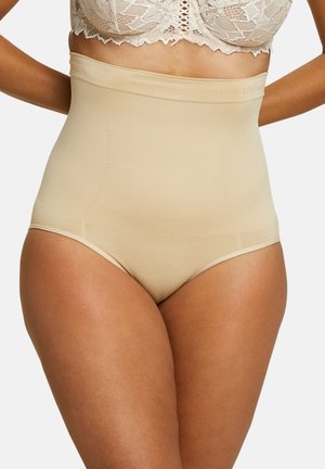 Shapewear beige taille haute avec une texture lisse. Doté d'une large ceinture et d'un design sans coutures pour un ajustement confortable.