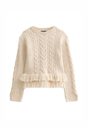 Cable knit sweater in light beige with a relaxed fit. Features textured patterns and a fringed hem for added detail.