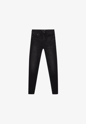 Jeans neri slim-fit in denim, con un classico design a cinque tasche, chiusura con zip e una leggera scoloritura per aggiungere texture.