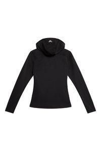 Svart långärmad hoodie med en figursydd design, slät textur och en rundad huva. Har subtil sömnad och en liten logotyp på ryggen.