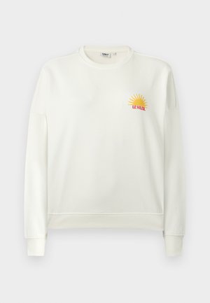 Balta garām piedurknēm džemperis ar ribveida aprocēm un apakšu, kreisajā krūtīs attēlots neliels dzeltens saule un sarkans teksts "LE SOLEIL".