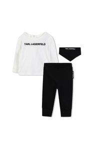 Witte longsleeve top met "KARL LAGERFELD" logo, zwarte leggings en bijpassende bandana slab. Zachte stof, casual pasvorm, minimalistisch ontwerp.