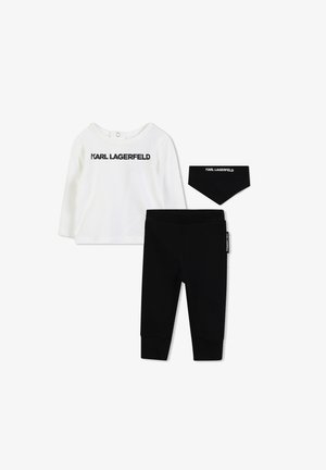 Witte longsleeve top met "KARL LAGERFELD" logo, zwarte leggings en bijpassende bandana slab. Zachte stof, casual pasvorm, minimalistisch ontwerp.
