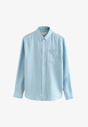 Hele sinine nööpidega särk, millel on pikad varrukad, rinna tasku ja tekstureeritud kangas. Omab klassikalist kraed ja valgeid nööpe.