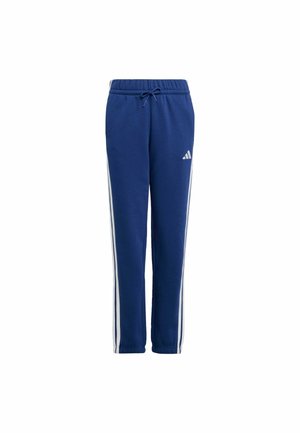 Pantalones de chándal de color navy con perneras cónicas, cinturilla elástica, cordón y rayas laterales blancas. Presenta un logo de Adidas en el muslo izquierdo.