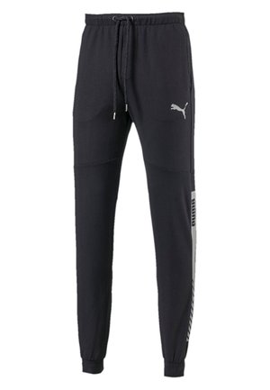 Schwarze Jogginghosen mit elastischem Bund und Kordelzug, ausgestattet mit einem hellgrauen Logo und seitlichen Akzenten; glattes Material, taillierter Beinschnitt.