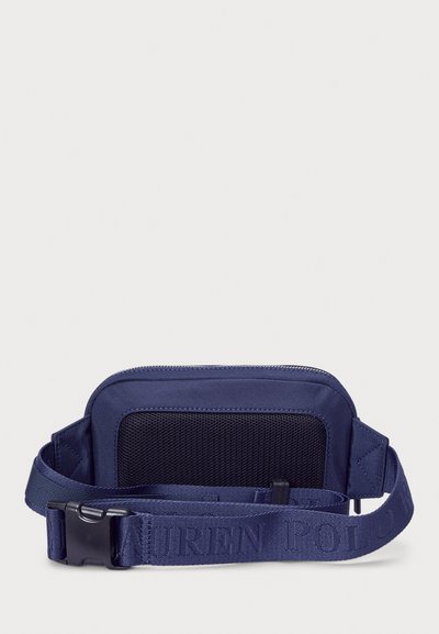 Navy blue nylon bag with a black mesh panel, zip closure, and adjustable strap featuring embossed logo detail. Rectangular shape, lightweight design.