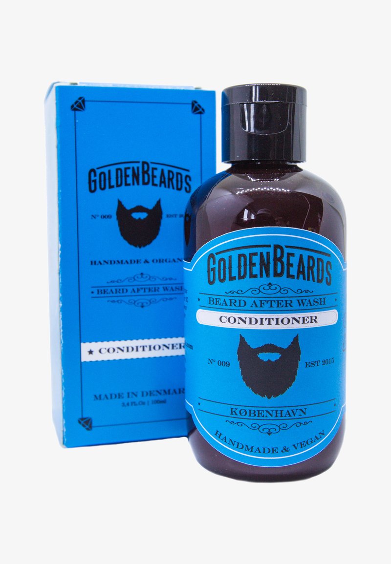 Baume après-shampooing pour barbe dans une bouteille marron foncé. Étiquette bleue avec des accents blancs, présentant un graphique de barbe. L'emballage est en carton, de couleur bleu assorti.