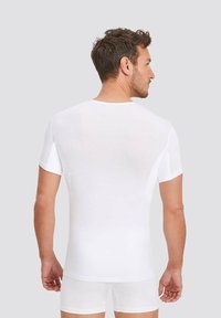 White short-sleeve t-shirt, featuring a crew neck, made of lightweight fabric, with a smooth texture, shown from the back.
