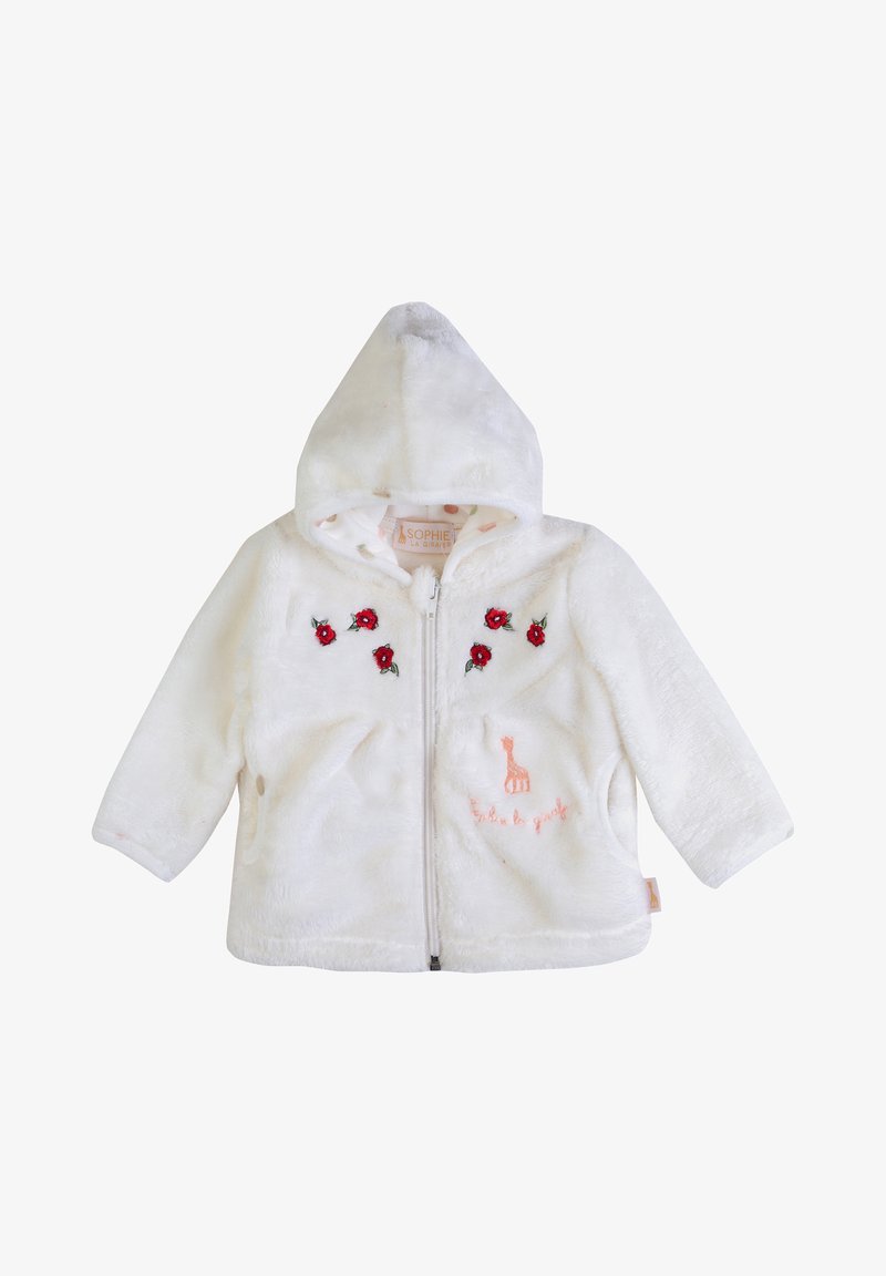 Giacca in pelliccia sintetica bianca con cappuccio, cerniera frontale, ricamo di fiori rossi e motivo di giraffa sulla tasca. Texture morbida e design accogliente.