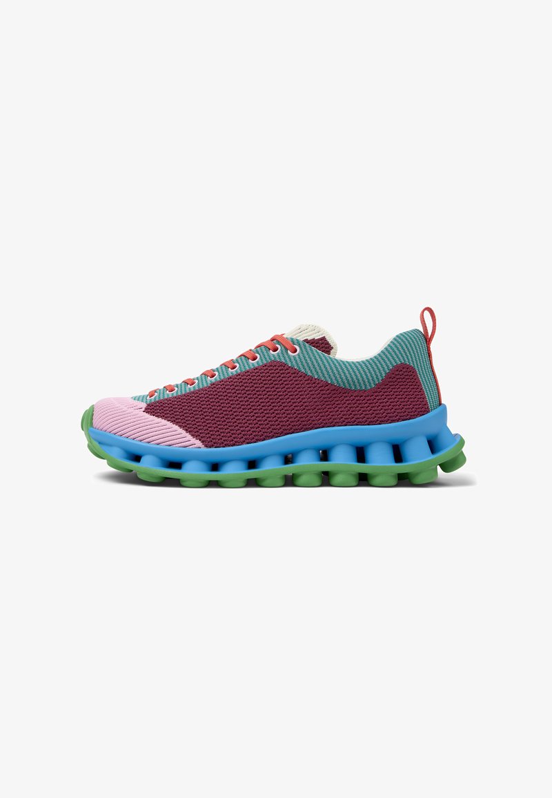 Multicolored sneaker featuring a mesh upper in teal, maroon, and pink. Bold blue midsole with green cushioning, and orange laces.
