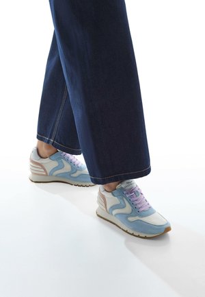 Light blue and white sneakers with lavender laces, suede and leather materials, featuring a textured sole and curved design accents.