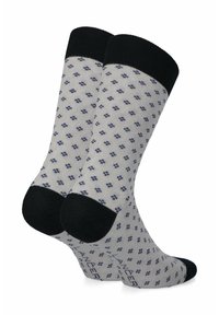 Szare skarpetki z granatowym wzorem małych diamentów, czarnymi ściągaczami oraz jednolitymi czarnymi akcentami na palcach i piętach. Materiał z mieszanki bawełny.