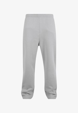 Pantalons de survêtement gris en tissu doux, avec une taille élastique et une coupe ample, jambes droites et sans motifs ni embellissements visibles.
