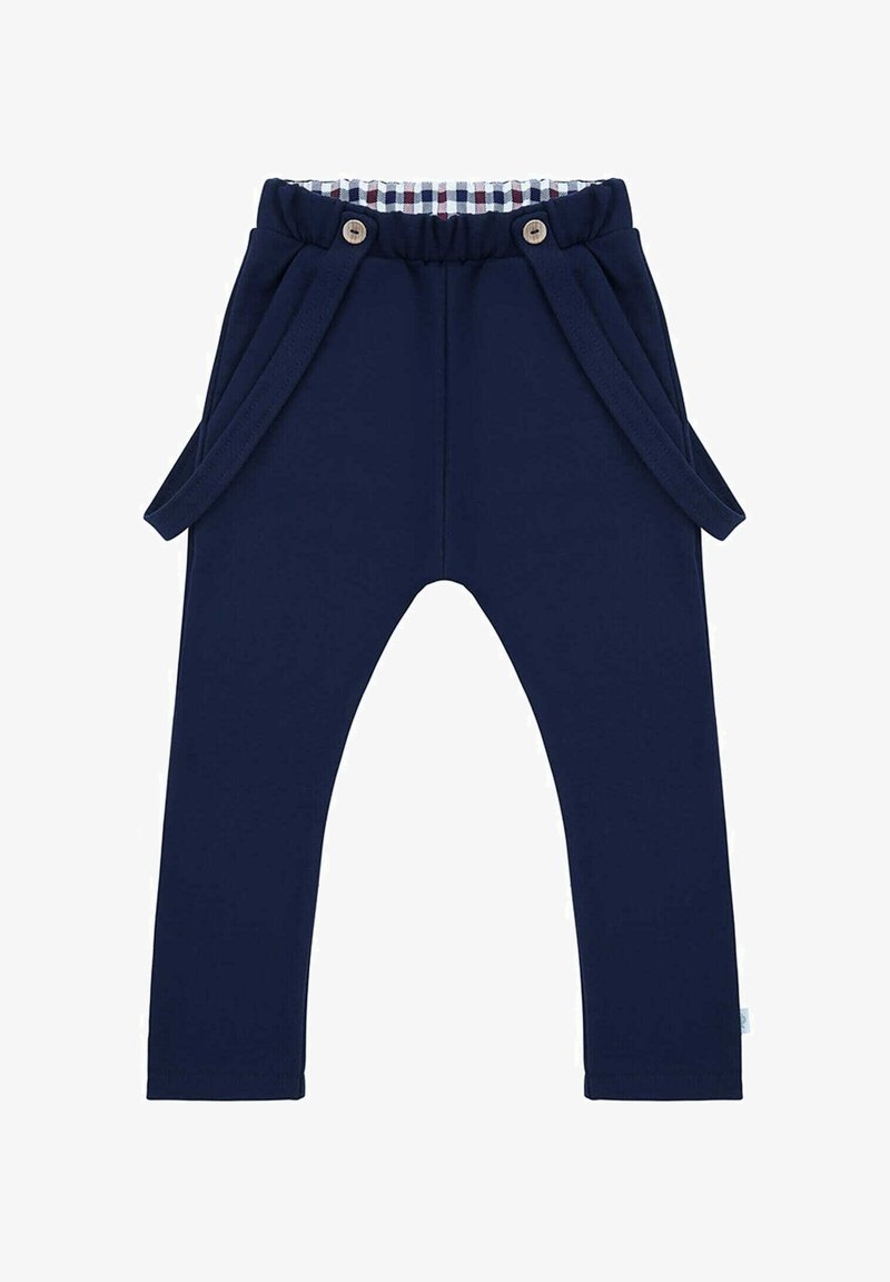 Granatowe spodnie wykonane z miękkiego materiału, z marszczonym pasem w talii z guzikami oraz bocznymi kieszeniami ozdobionymi sznurkami. Widoczna podszewka w kratkę.