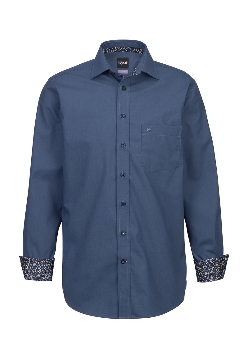 Camicia blu navy con bottoni, a maniche lunghe, con polsini decorati e tasca sul petto. Realizzata in tessuto liscio con un design classico del colletto.