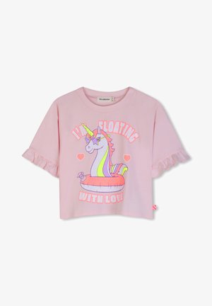 Rózsaszín rövid ujjú ing fodros mandzsettákkal, melyen egy csillag alakú napszemüveget viselő unikornis látható egy úszógumiban, valamint a "Szeretettel sodródom" felirat.