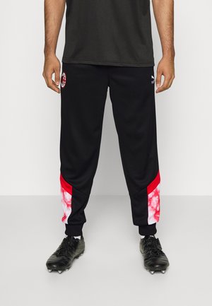 Schwarze Sporthose mit roten und pinken Batik-Akzenten an den unteren Seiten. Hergestellt aus weichem Material mit elastischen Bündchen und Logodetails.