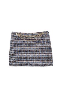 Torebka z tweedu w granatowo-beżowym kolorze z wzorem w kratę. Posiada metalowy łańcuszek oraz dwa okrągłe złote ćwieki na przodzie.