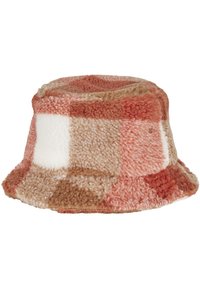 Patchwork bucket hat made of soft fleece in shades of orange, cream, and brown; textured, round top, and wide, slightly floppy brim.