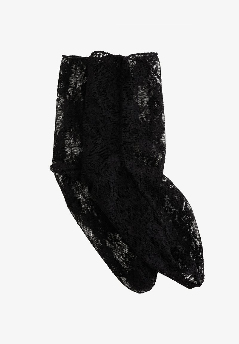 Črne čipkaste gležnjske nogavice s cvetličnim vzorcem in prosojnim materialom, zasnovane za nežni in dekorativni videz.