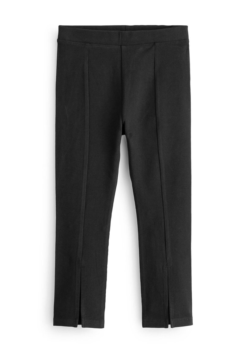 Schwarze Leggings mit glatter Textur, featuring ein enganliegendes Design, Seitennähte und Schlitze am Knöchel für zusätzlichen Detail.