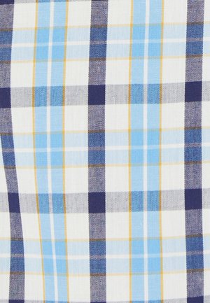 Katoenen stof met een blauw en marineblauw ruitpatroon met witte en gele accenten. Gestructureerde weving met afwisselend grote en kleine ruiten.