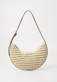 Crochet bag with a half-moon shape, made of natural colored material, featuring a dark brown leather strap and understated woven texture.
