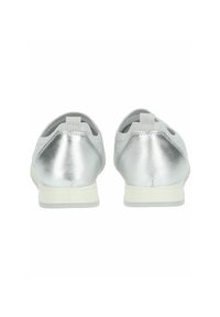 Silver metallic slip-on shoes with a textured upper, white sole, and elastic accents at the back for flexible fit. Suitable for casual wear.