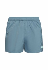 Costumi da bagno da uomo in azzurro chiaro, realizzati in un tessuto liscio e leggero. Presentano una vita elastica e tasche laterali. Branding minimale sull'orlo.