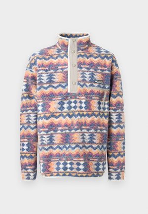 Sudadera de manga larga con forro polar, con patrones geométricos coloridos, tapeta con botones a presión, cuello alto, bolsillo en el pecho con cremallera y puños elásticos.