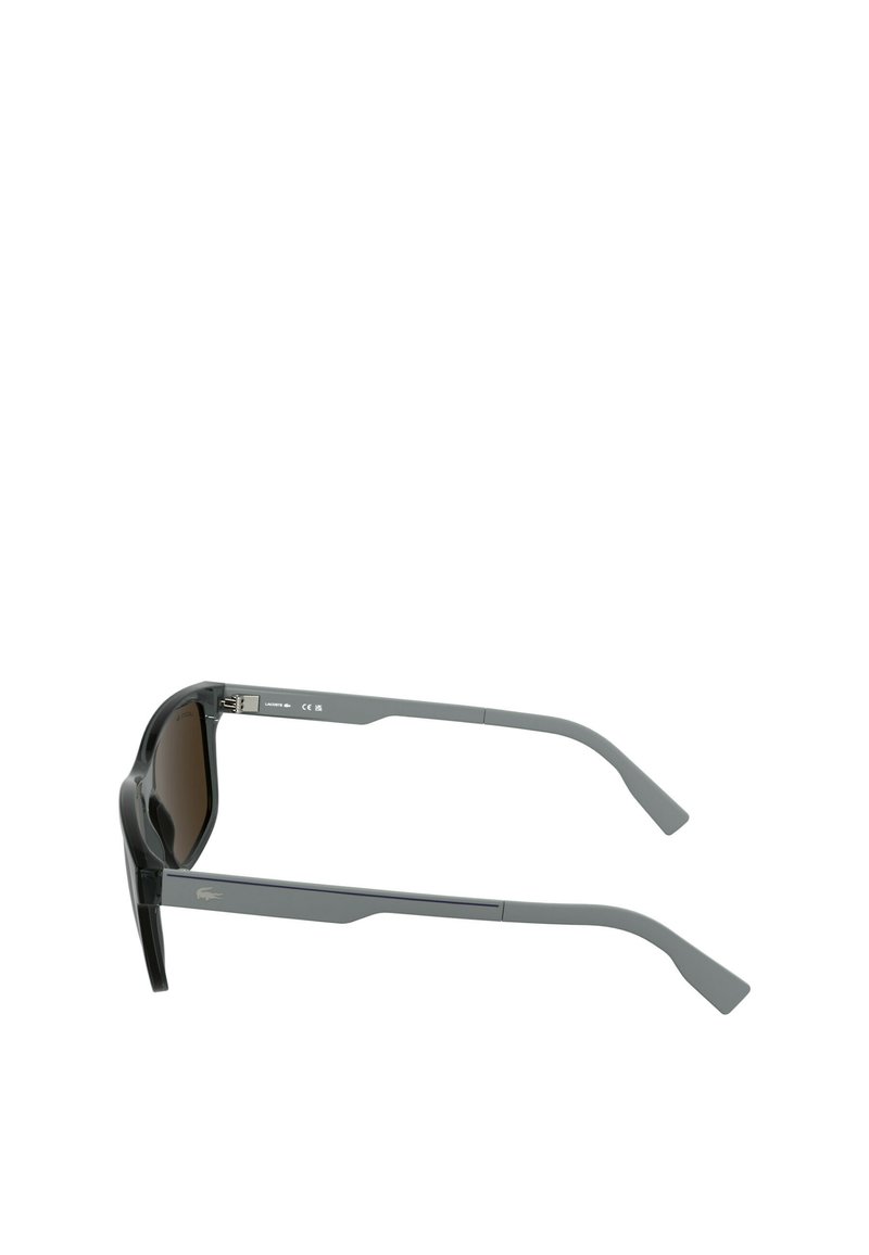 Gray sunglasses feature a sleek, angular design with brown tinted lenses and lightweight plastic frames. Notable logo detail on temple.