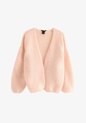 Pehmeä vaaleanpunainen neulottu neuletakki, jossa on ylisuuria hihoja, avoin etuosa ja hieman väljä istuvuus.