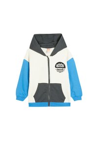 Chaqueta con capucha y cremallera en crema, gris y azul. Cuenta con bolsillos frontales, diseño de texto "GOOD", puños acanalados y una textura de tela suave.