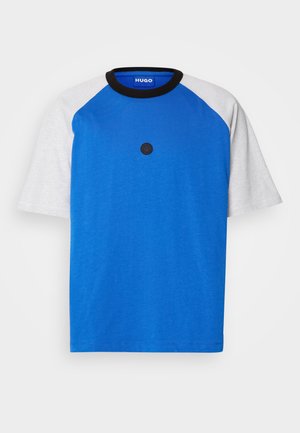 Blue short-sleeve t-shirt with gray raglan sleeves, round black collar, and a black circular logo on the front. Smooth cotton texture.