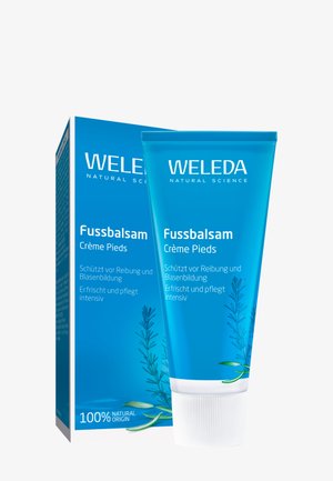 Weleda Fussbalsam crème tube in helderblauw, met witte tekst en natuurlijke illustraties. Vergezeld van een bijpassende verpakking doos.