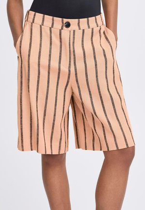 Peach-colored shorts with black vertical stripes, made of textured fabric. Features front pockets and a single button closure at the waist.