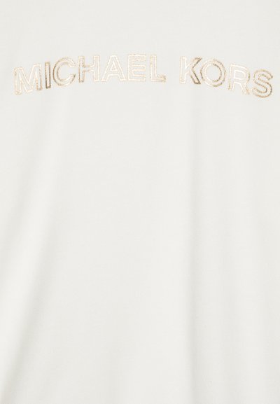 Hvit bomullst-skjorte med "MICHAEL KORS" brodert i gulltråd. Myk tekstur med en jevn finish og rund hals.