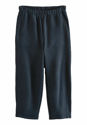 Svarta joggerbyxor i mjukt tyg, med elastisk midja, två sidfickor och en avslappnad, avsmalnande passform.