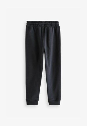 Mustad mustad, mis on valmistatud pehmest kangast, elastse vöökoha ja ribaga pahkluudel, et saavutada istuv välimus. Sile tekstuur.