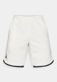 White fabric shorts with an elastic waistband, side pockets, and black trim at the hem. Features a logo in black on the left side.