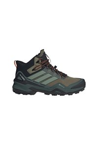 Buty trekkingowe z ciemnozieloną i czarną cholewką, wykonane z siateczkowych i teksturowanych materiałów, systemem sznurowania oraz wytrzymałą czarną gumową podeszwą.