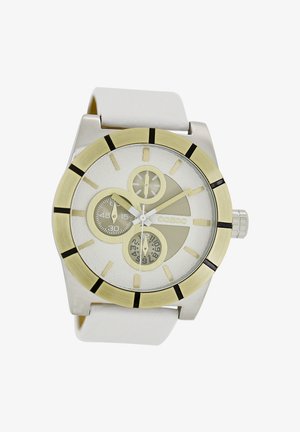 Montre argentée et dorée avec un boîtier rond, un bracelet en cuir blanc, plusieurs sous-cadrans, un cadran blanc texturé et des index horaires noirs.