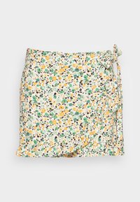 Jupe portefeuille florale en tissu léger blanc avec des motifs verts, jaunes et noirs. Ourlet froncé et détail de lien sur le côté.