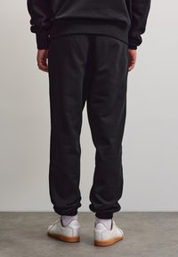 Pegador LOGO HEAVY JOGGER - Træningsbukser - washed black