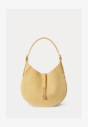 Geantă bej din piele intoarsă, în formă de semilună, cu o singură curea și un clapetă frontală cu un mic logo embosat.