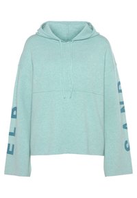 Helle teal-farbene, oversized Kapuzenpullover mit einer Kordelzugkapuze, langen Ärmeln und "SAND" in dunkelblau auf dem linken Ärmel gedruckt. Weiche Textur.