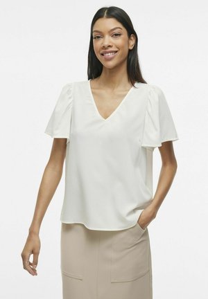 White V-neck blouse with short puff sleeves, made of lightweight fabric. The design features a relaxed fit and smooth texture.