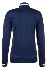 Navy long-sleeve jacket with a high collar, white accent stripes on the cuffs, and smooth, textured fabric. Back view shows clean lines.